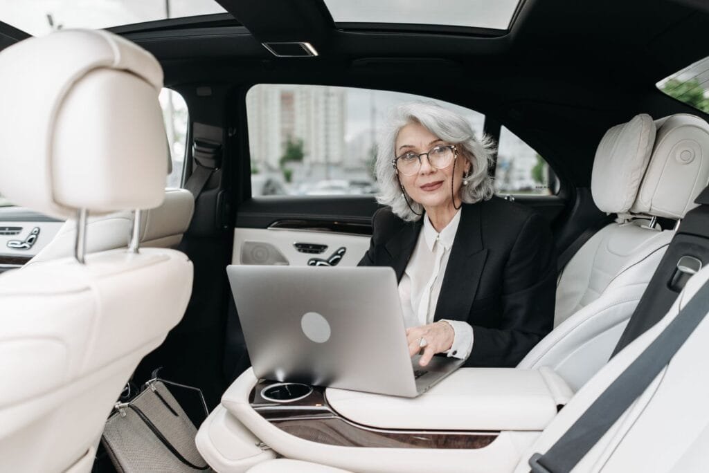 how to book luxury rides for corporate travel in Oakland